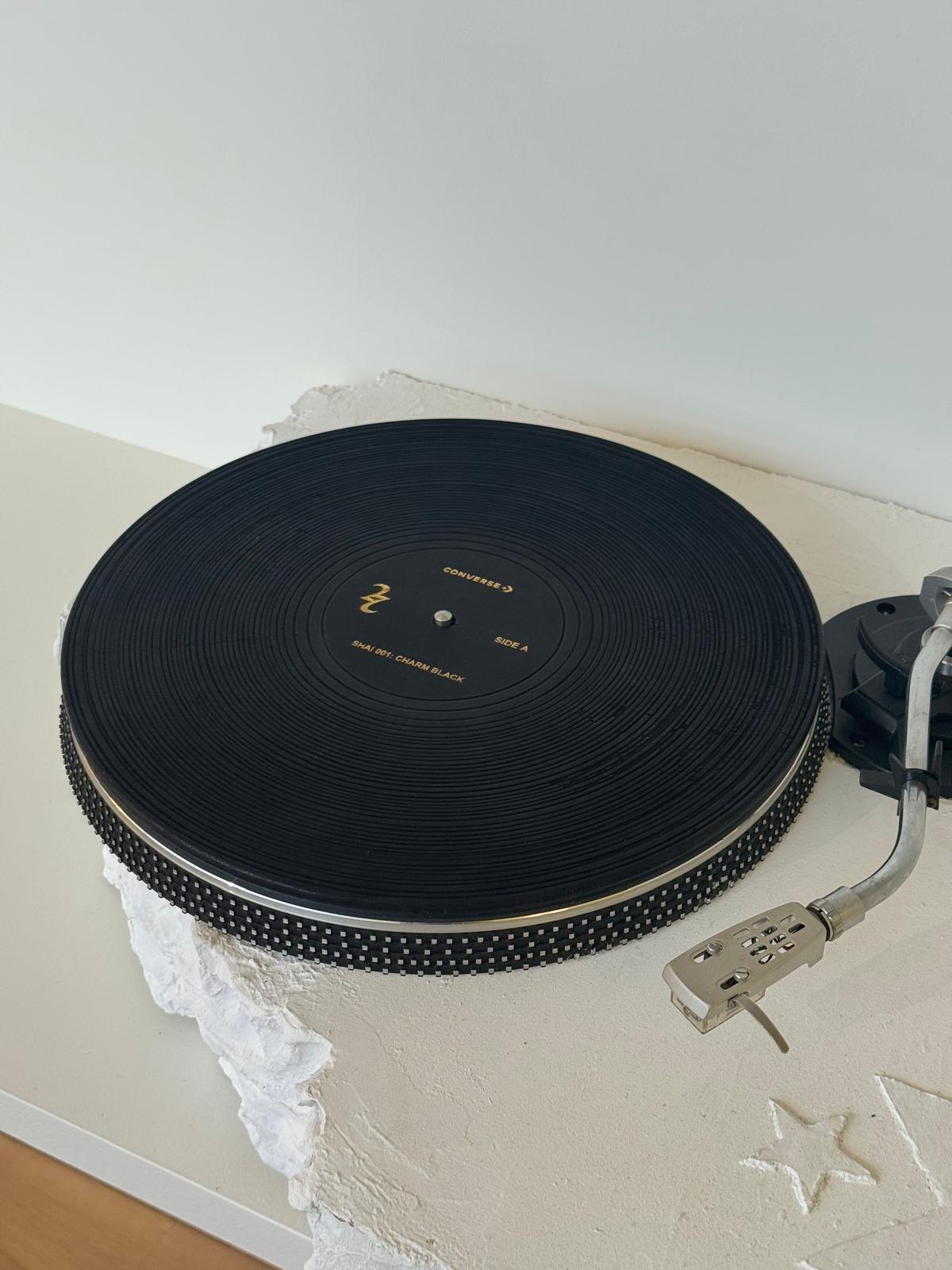 Converse Shai 001, a sculpted vinyl record on raw white plaster