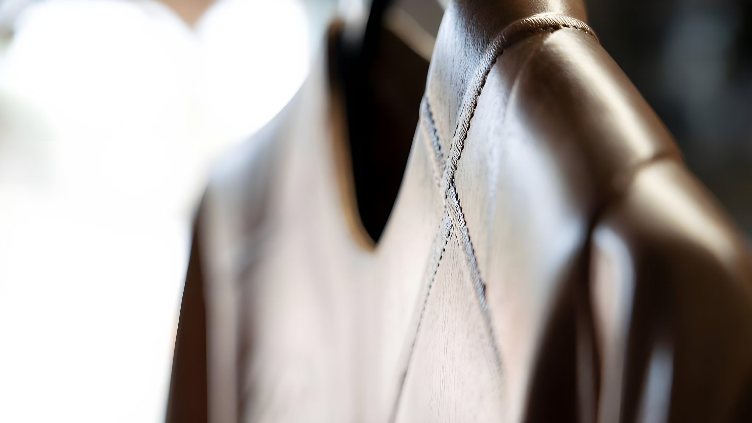 Detail of a jacket carved in wood